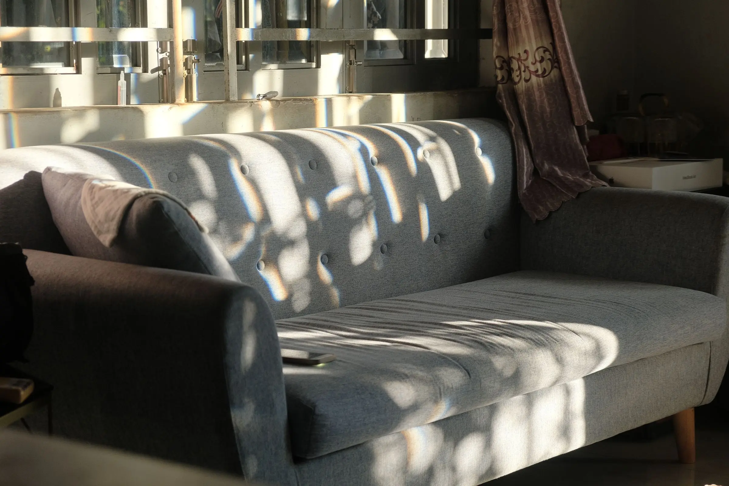 Sunlight crossing a living room in a modern home